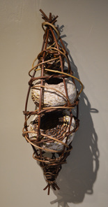 These clay kudzu baskets are encased in a pod made out of grapevine. Matt Tommey of the River Arts District in Asheville, North Carolina handcrafts these baskets from natural materials. 