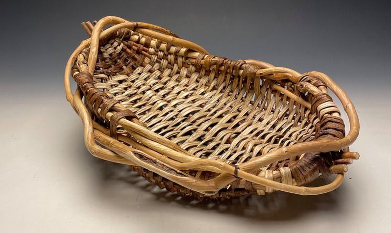 Appalachian inspired harvest basket by Matt Tommey made from Kudzu, honeysuckle vines and willow branches. Infused with Encaustic wax.