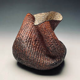 freeform twined basket by matt tommey using kudzu, poplar bark and encaustic wax