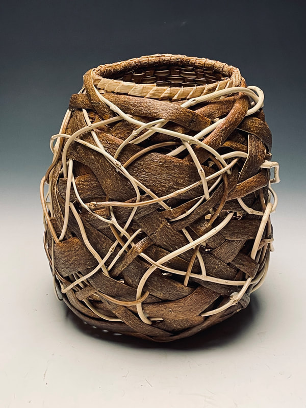 Random weave basket by Matt Tommey made from mimosa and poplar bark, kudzu, copper wire and honeysuckle vines.