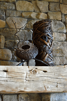 2 Baskets With Branches As Fireplace Mantel Art