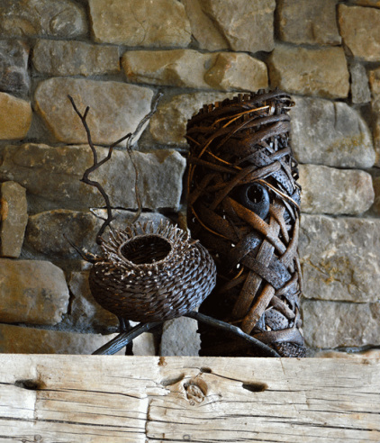 Basket And A Woven Tower Being Used As Fireplace Sculptures